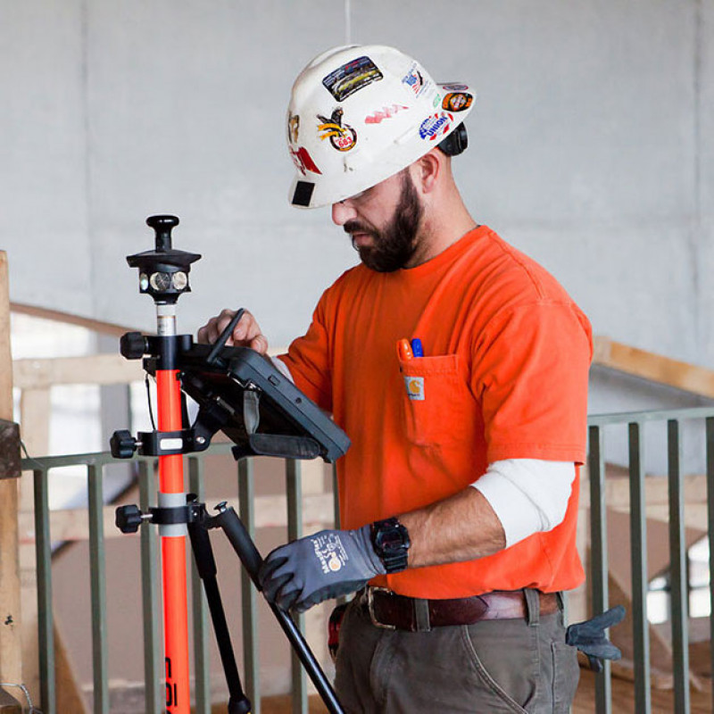 Mid-City employee working with technology